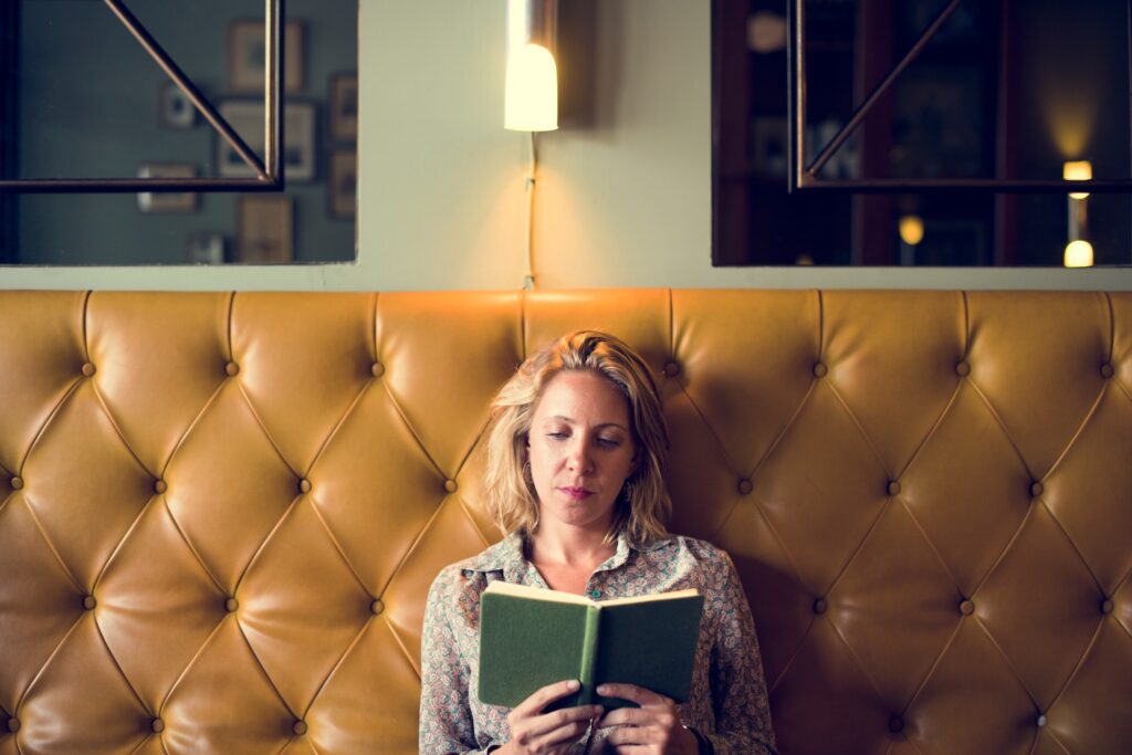 Blond woman reading a book