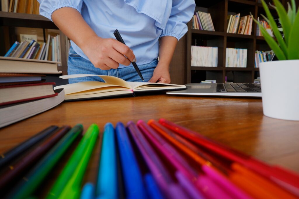 female student reading books study research in library for education concept