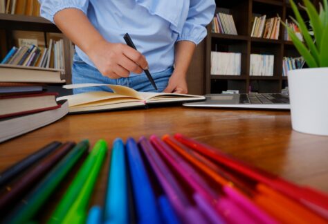 female student reading books study research in library for education concept